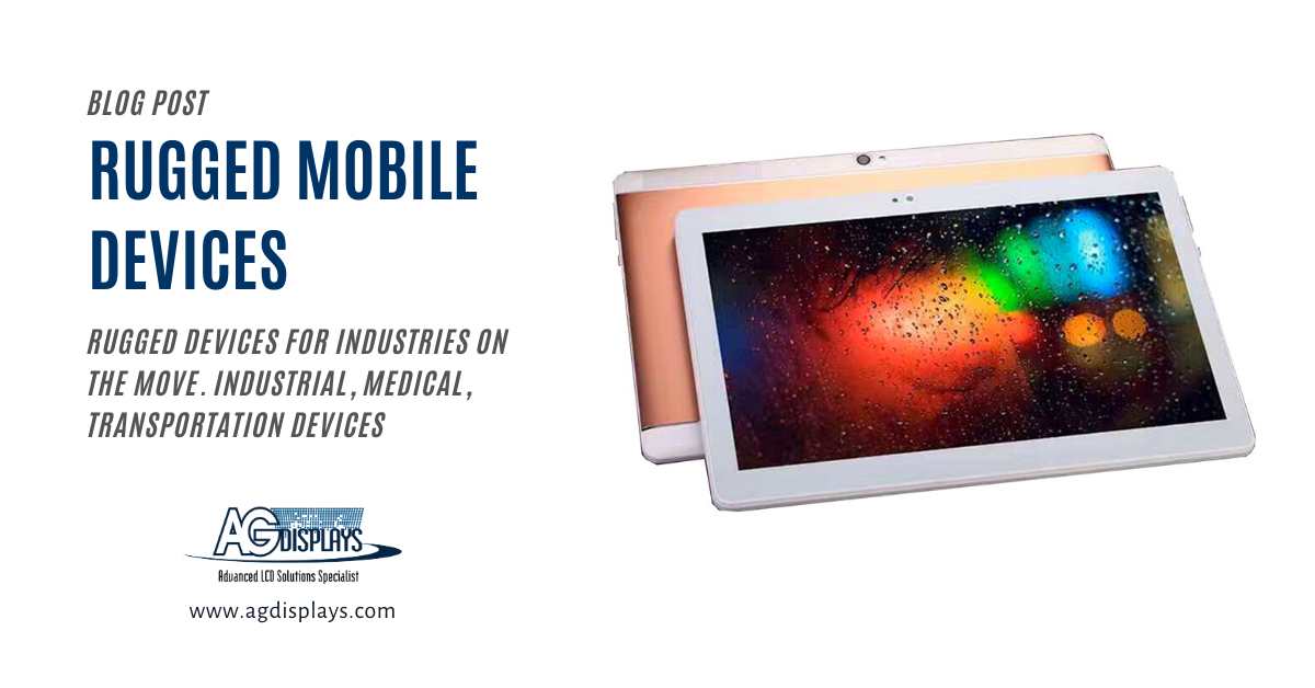 A blog post graphic titled "RUGGED MOBILE DEVICES" in large blue text. Below, smaller grey text reads "RUGGED DEVICES FOR INDUSTRIES ON THE MOVE. INDUSTRIAL, MEDICAL, TRANSPORTATION DEVICES". To the right, a slightly angled view of two rugged tablets is shown. The tablet in the foreground has a white bezel and displays a colorful, abstract image with dark background and bright speckles of red, green, blue, and yellow. The tablet behind it has a gold or tan back and is partially visible. The "AGDisplays" logo and website address are in the bottom left corner.