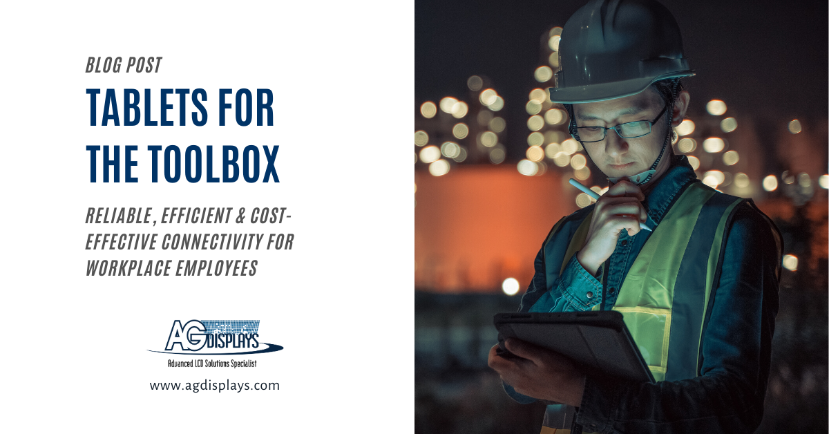 A blog post graphic titled "TABLETS FOR THE TOOLBOX" in large blue text. Below, smaller grey text reads "RELIABLE, EFFICIENT & COST-EFFECTIVE CONNECTIVITY FOR WORKPLACE EMPLOYEES". To the right, a slightly blurred image shows a worker wearing a hard hat and safety vest, looking down at a tablet they are holding and making notes with a pen. The background is dark with blurred industrial lights. The "AGDisplays" logo and website address are in the bottom left corner.