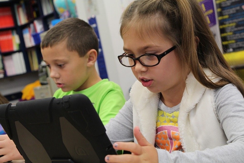 A Student uses a rugged tablet in class.