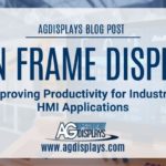 A slightly blurred image of an industrial setting with an open frame display integrated into a control panel showing data and graphs, overlaid with a white banner stating "AGDISPLAYS BLOG POST" at the top, followed by "OPEN FRAME DISPLAYS Improving Productivity for Industrial HMI Applications," and the AGDisplays logo with "www.agdisplays.com" at the bottom. The color palette is muted with tones of blue, white, and beige.